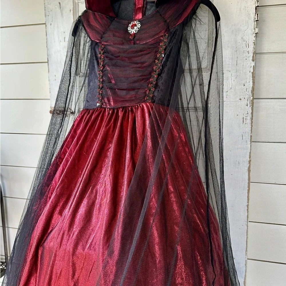 HALLOW’S EVE, GIRLS WITCH COSTUME.LONG DRESS WITH HOOP,IN RED/BLACK.SIZE S(7-8)